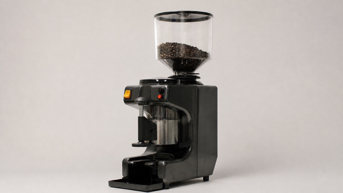 Astra MG050 semi-automatic coffee grinder with a hopper of roasted beans