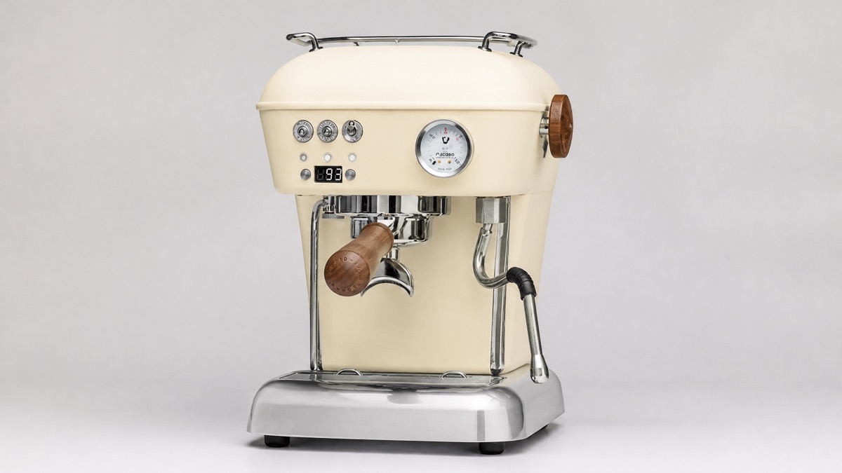 Cream Ascaso Dream PID espresso machine with walnut portafilter handle on a neutral background