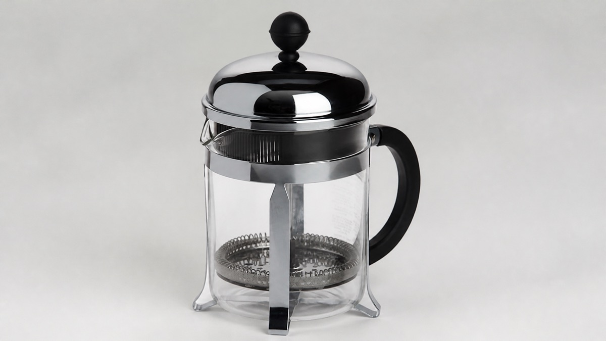 Bodum Chambord French press with glass beaker, chrome frame and black handle on a neutral background